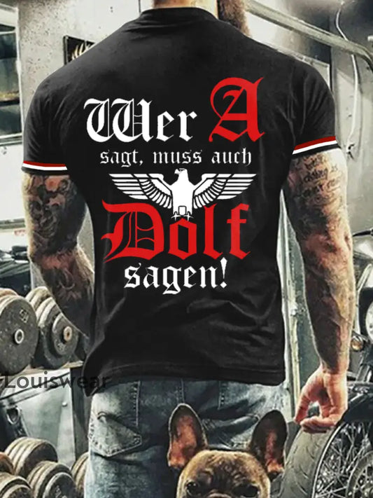 Herren Wer A Sagt Muss Auch Dolf Sagen Bedrucktes Kurzarm-T-Shirt Schwarz / S